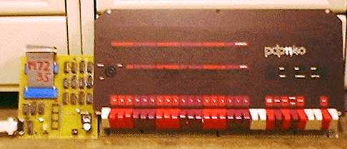 [photo: the interface PC board next to a real KY11-D PDP-11/40 console]